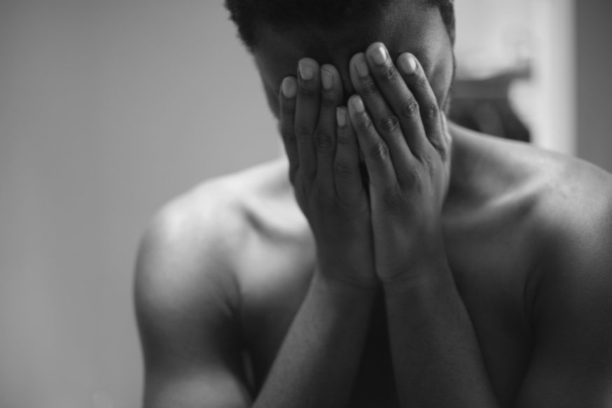 woman covering eyes
