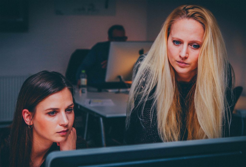 women researching to find the right divorce attorney