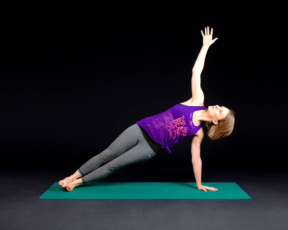 woman-exercising-yoga-side-plank